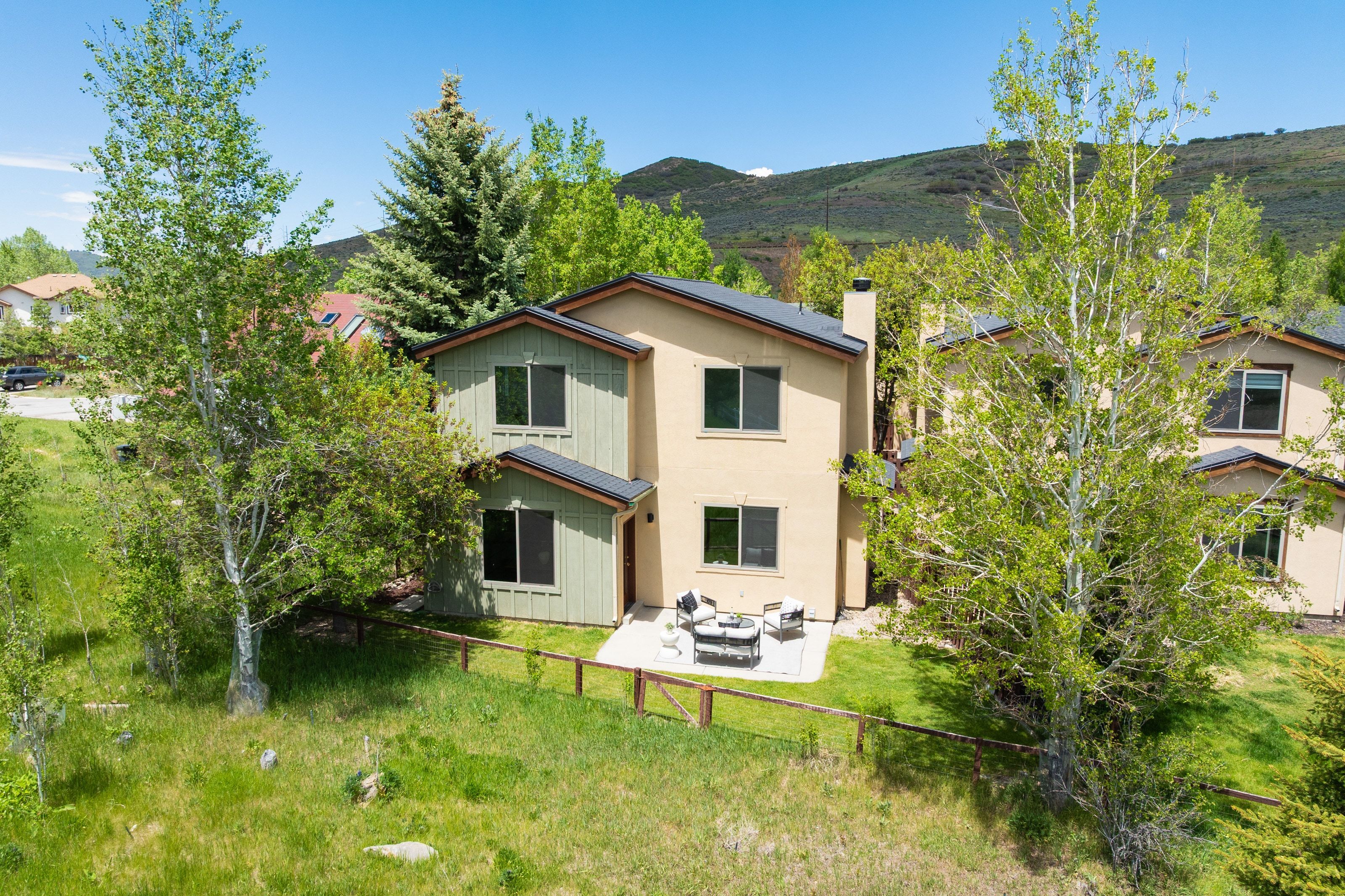 Two-story stucco and board and batten exterior