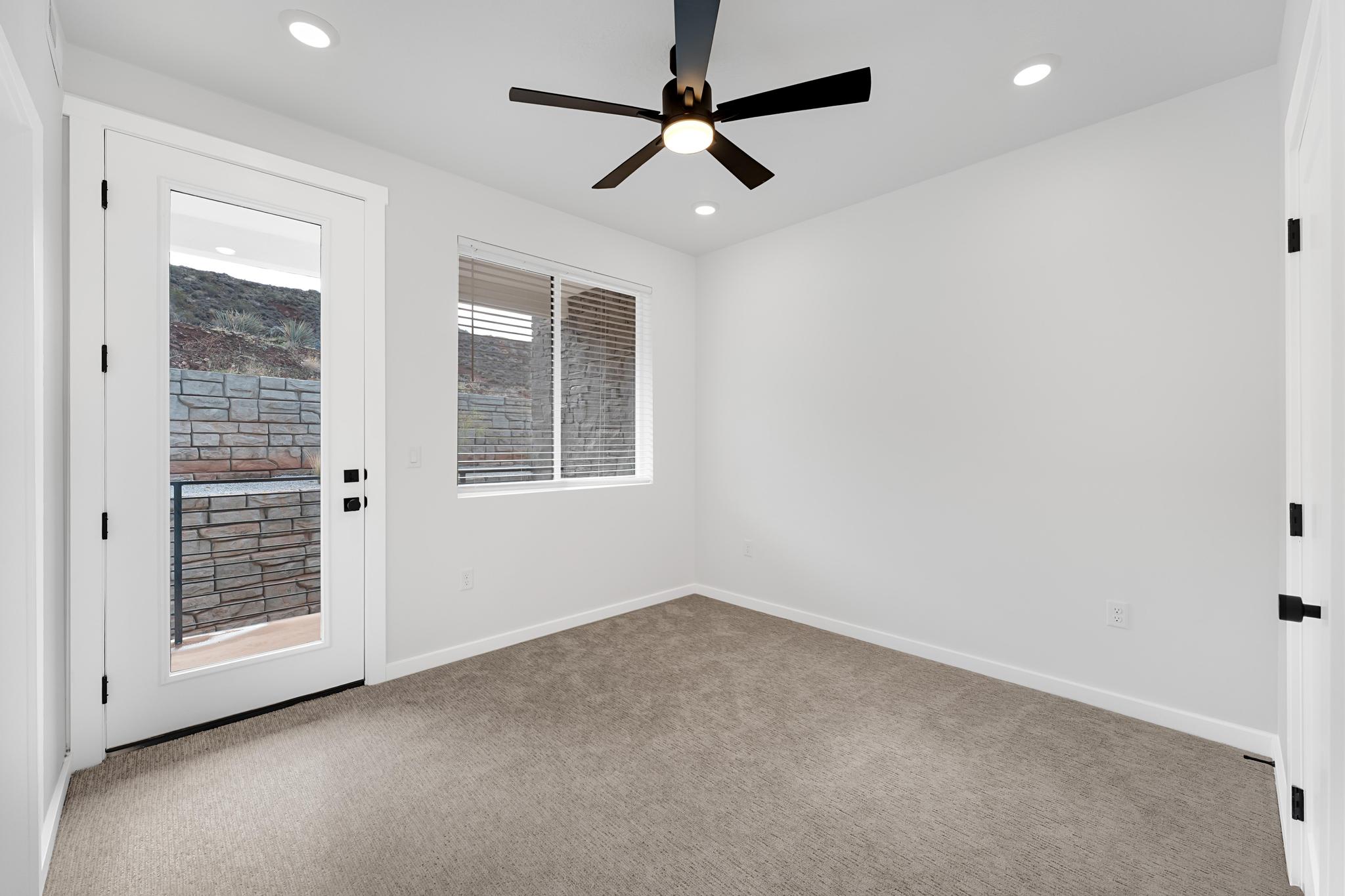 Interior room with white walls and light-toned carpet