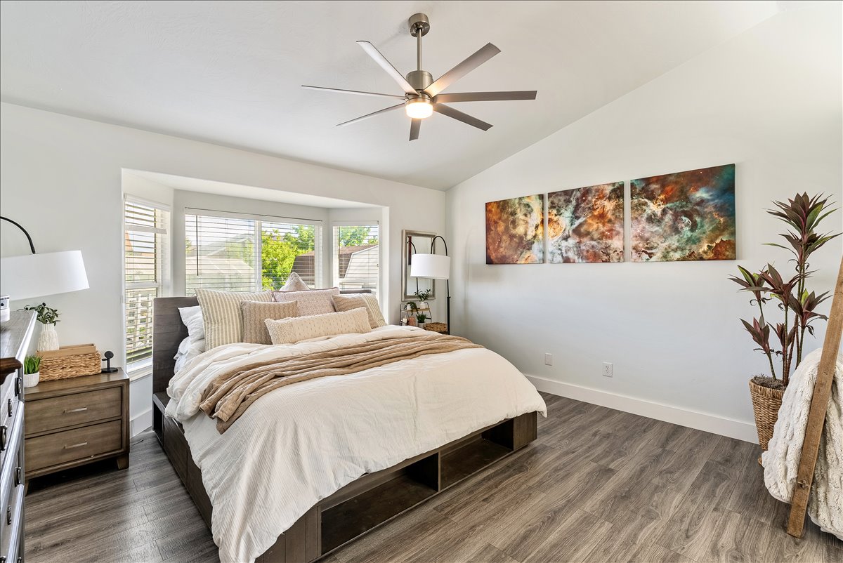Vaulted ceiling with a contemporary ceiling fan and light fixture
