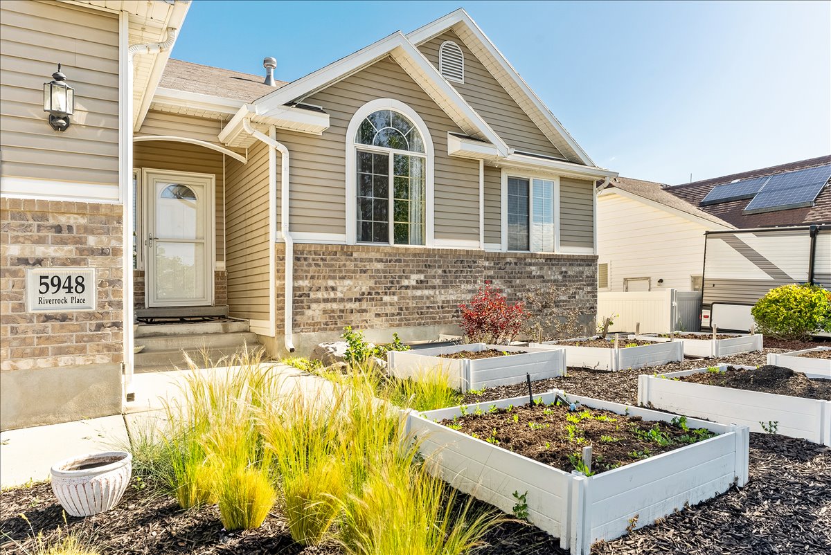 Exterior facade featuring brick accents and horizontal siding