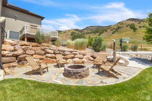 Stone patio with a built-in fire pit