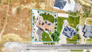 Aerial overview of a residential property featuring a large home with a hip roof and solar panels