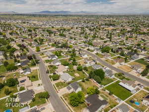 Aerial view of a residential community featuring extensive street networks, numerous single-family homes, and mature landscaping