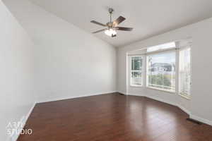Hardwood-finish flooring complementing a vaulted ceiling