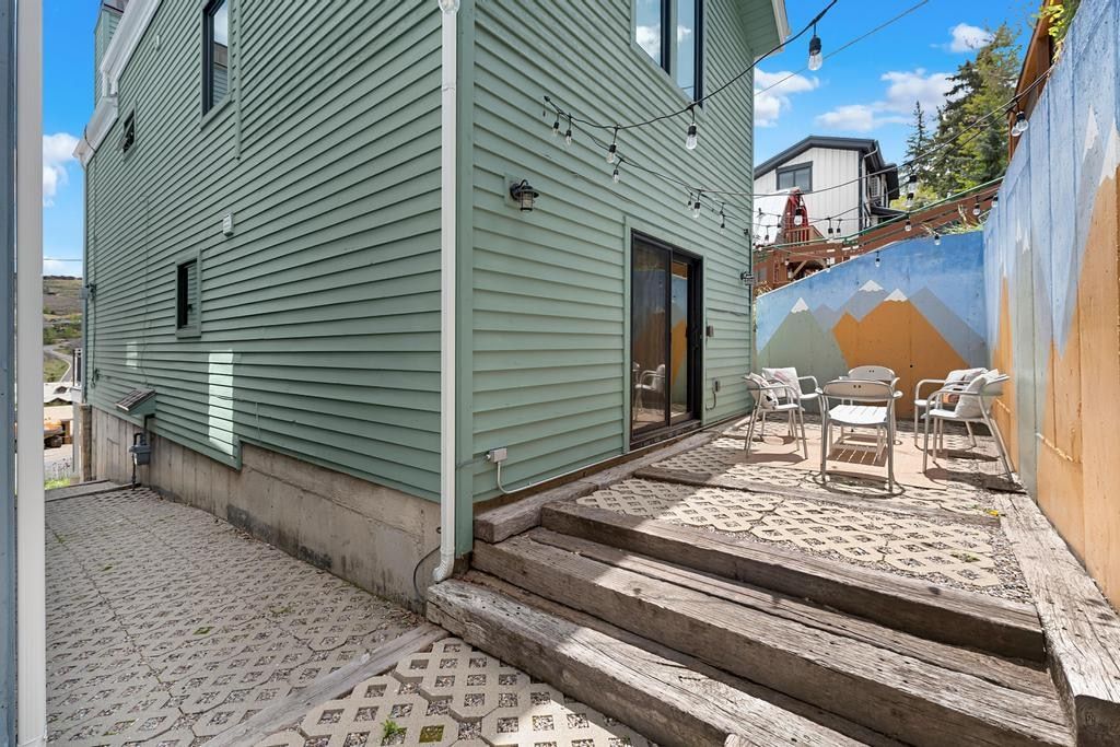 Private outdoor patio area featuring a sliding glass door entry
