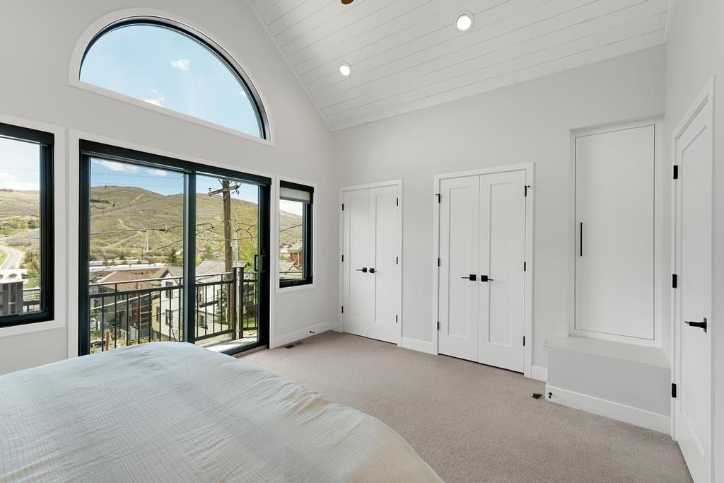 Vaulted ceiling with horizontal paneling and recessed lighting