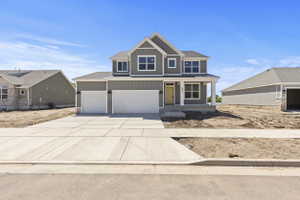 Contemporary two-story residence with a gray siding exterior and white trim accents