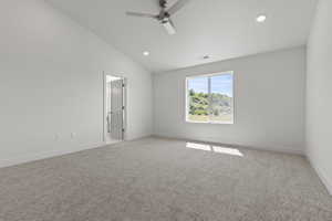Neutral-toned carpet flooring in a room with a large window