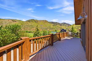 Expansive outdoor deck featuring composite decking and a natural wood railing