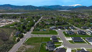 Expansive residential development featuring newly constructed homes with dark roofs and light-colored siding