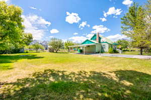 Expansive grassy yard with mature trees