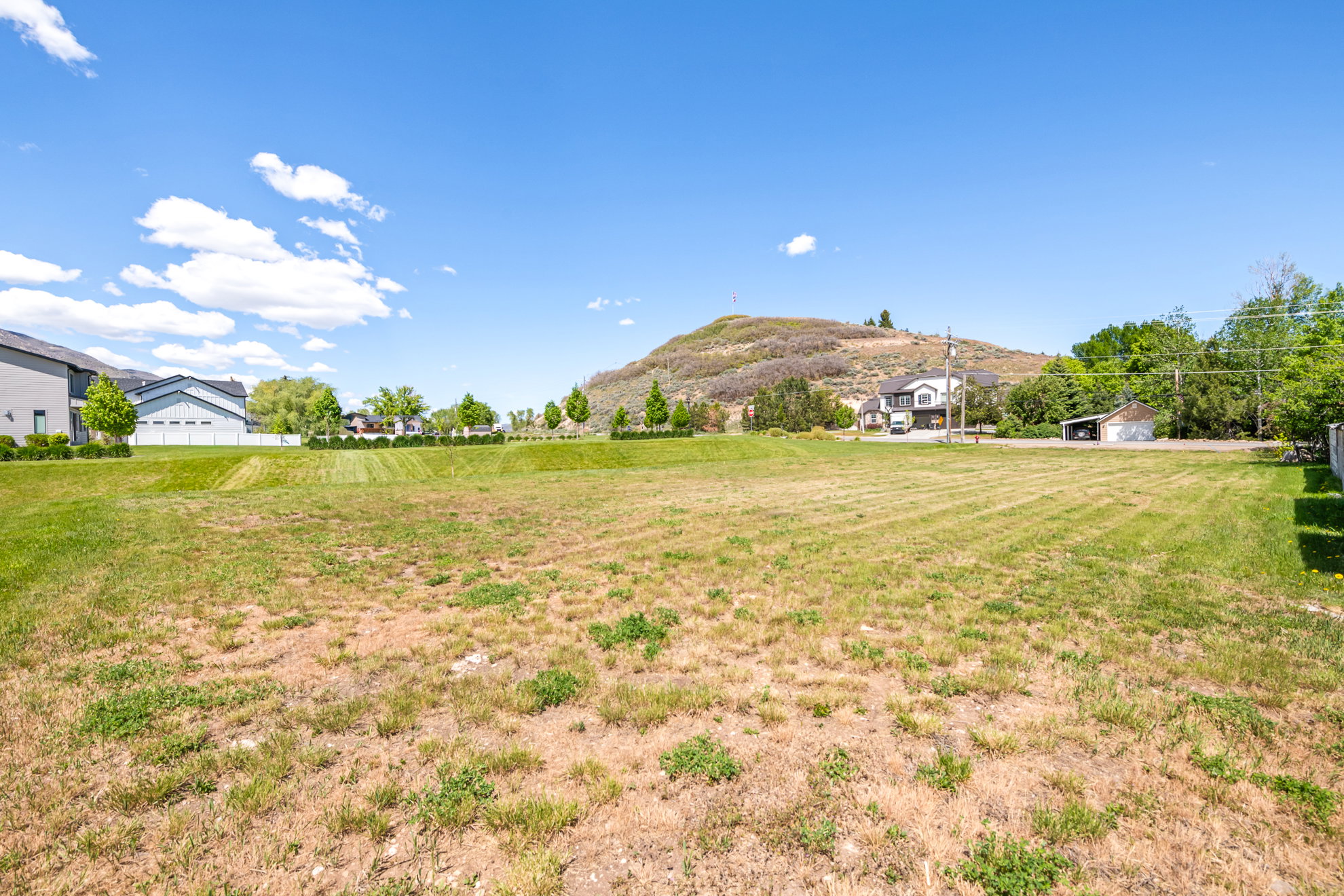 Expansive undeveloped lot with natural terrain