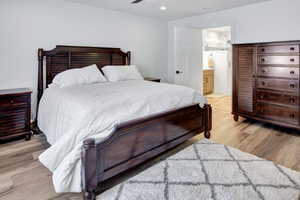Bedroom featuring LVP flooring, recessed lighting, and a ceiling fan