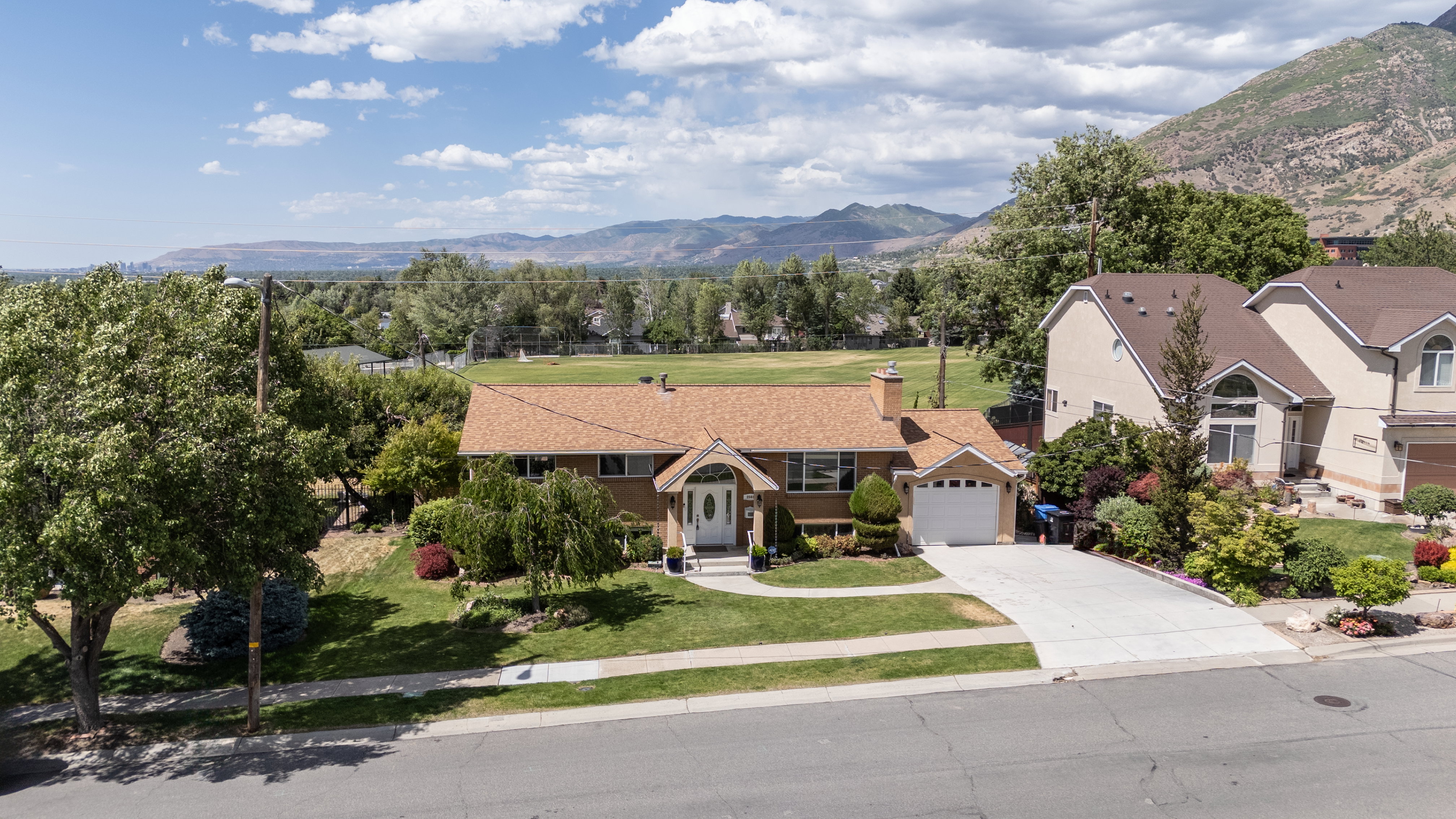Single-story residence featuring an attached garage and a concrete driveway
