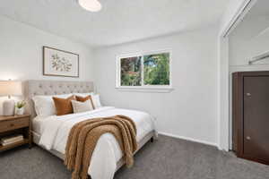 Virtual staging included to showcase room potential. Bedroom featuring gray carpeting and white walls