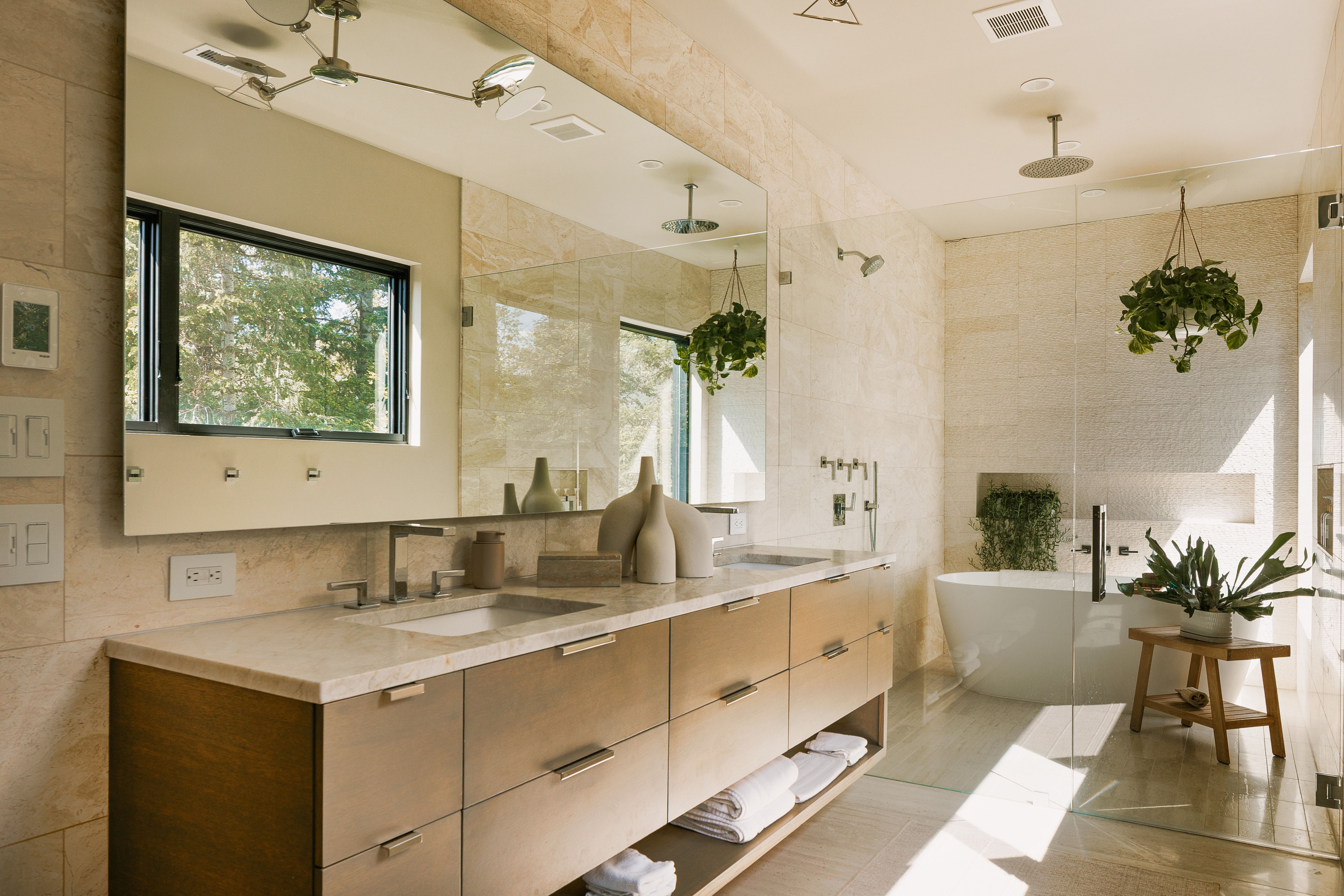 Dual vanity featuring an integrated rectangular sink, stone countertop, and wood-finish cabinetry