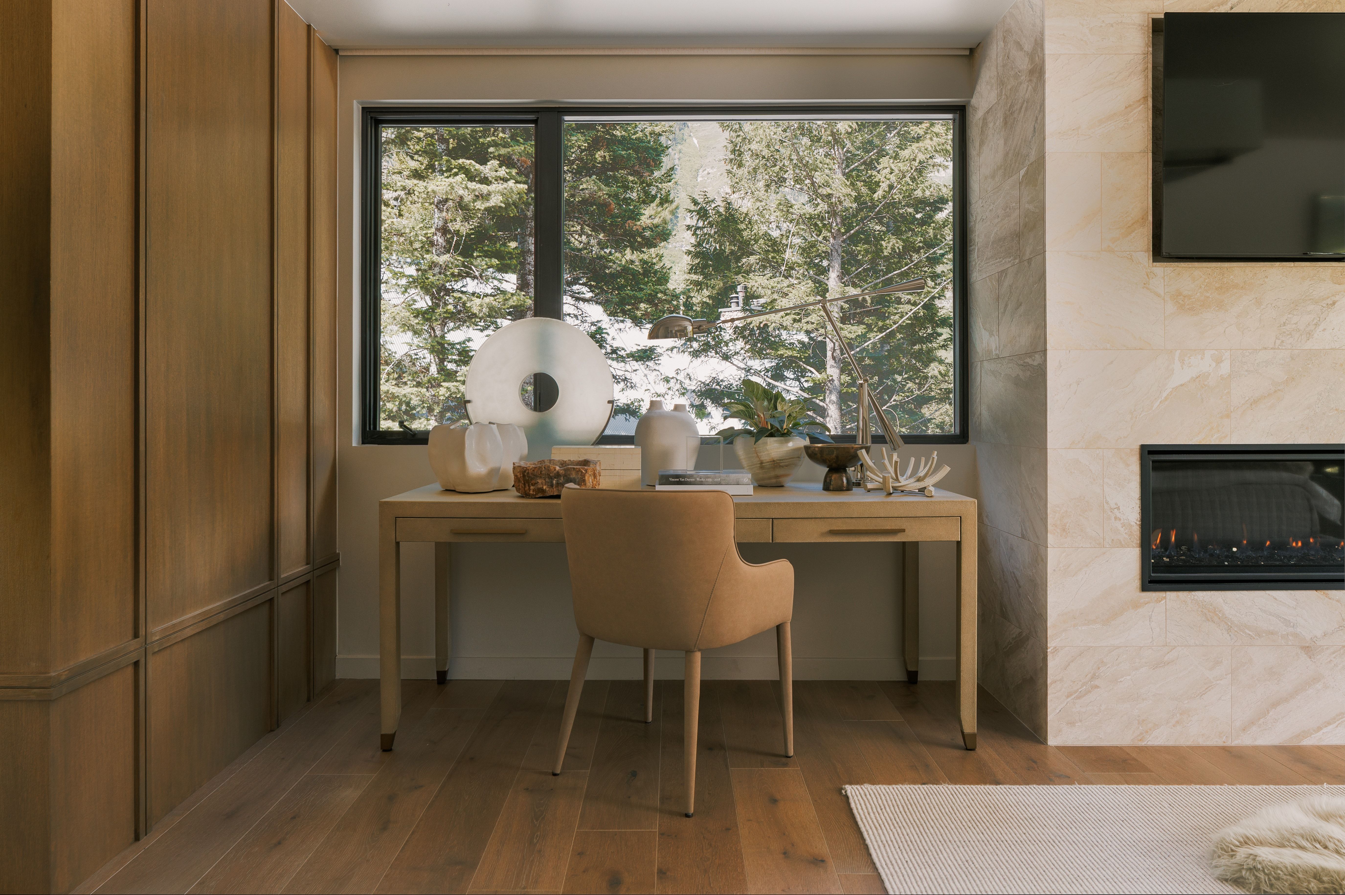 Wood-finish flooring throughout, complemented by a floor-to-ceiling wood-paneled wall
