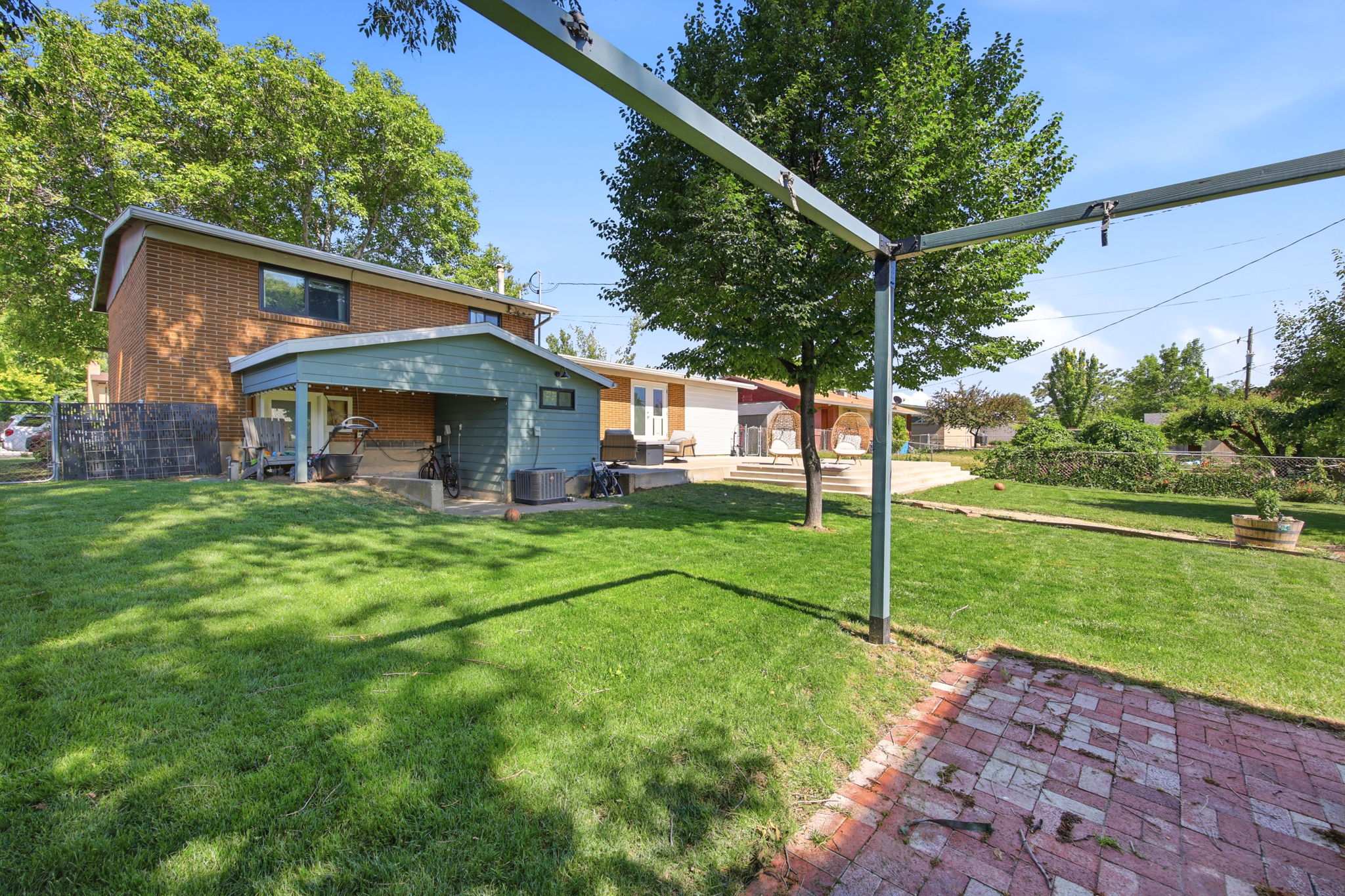 Expansive backyard with a lush green lawn
