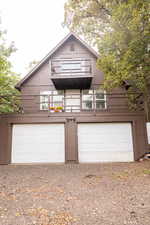 Brown exterior with white trim, featuring a prominent A-frame roofline