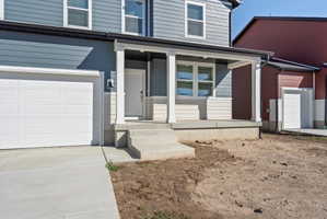 Two-story residence featuring blue horizontal siding and cream-colored lower siding