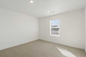 **DISCLAIMER** Interior package may vary. Room featuring neutral-toned carpet, white walls, and recessed lighting