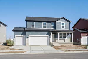 Two-story residence featuring a blue siding exterior with white trim accents and a dark shingle roof