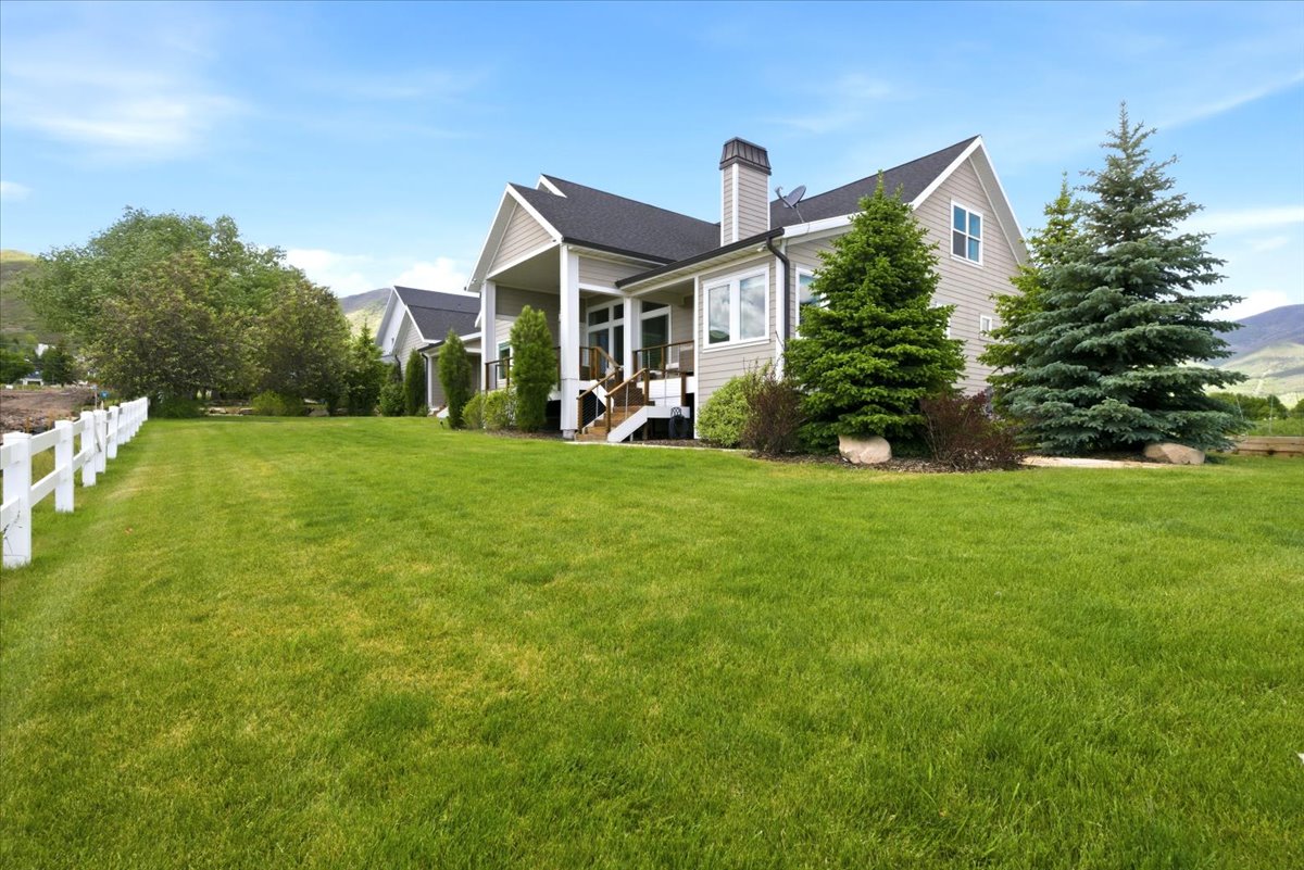 View of Backyard featuring tress