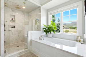 Spacious bathroom featuring a large window with a mountain backdrop