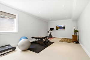 Bedroom/Exercise room Featuring a spacious ceiling