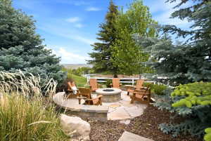 Stone fire pit area with a flagstone patio