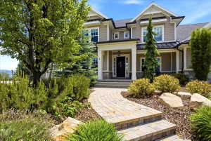 Front of Home walkway featuring shrubs