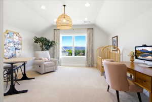 Bedroom featuring a prominent window, recessed lighting, and sloped ceilings