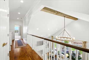 Level 2 hallway featuring an interior balcony