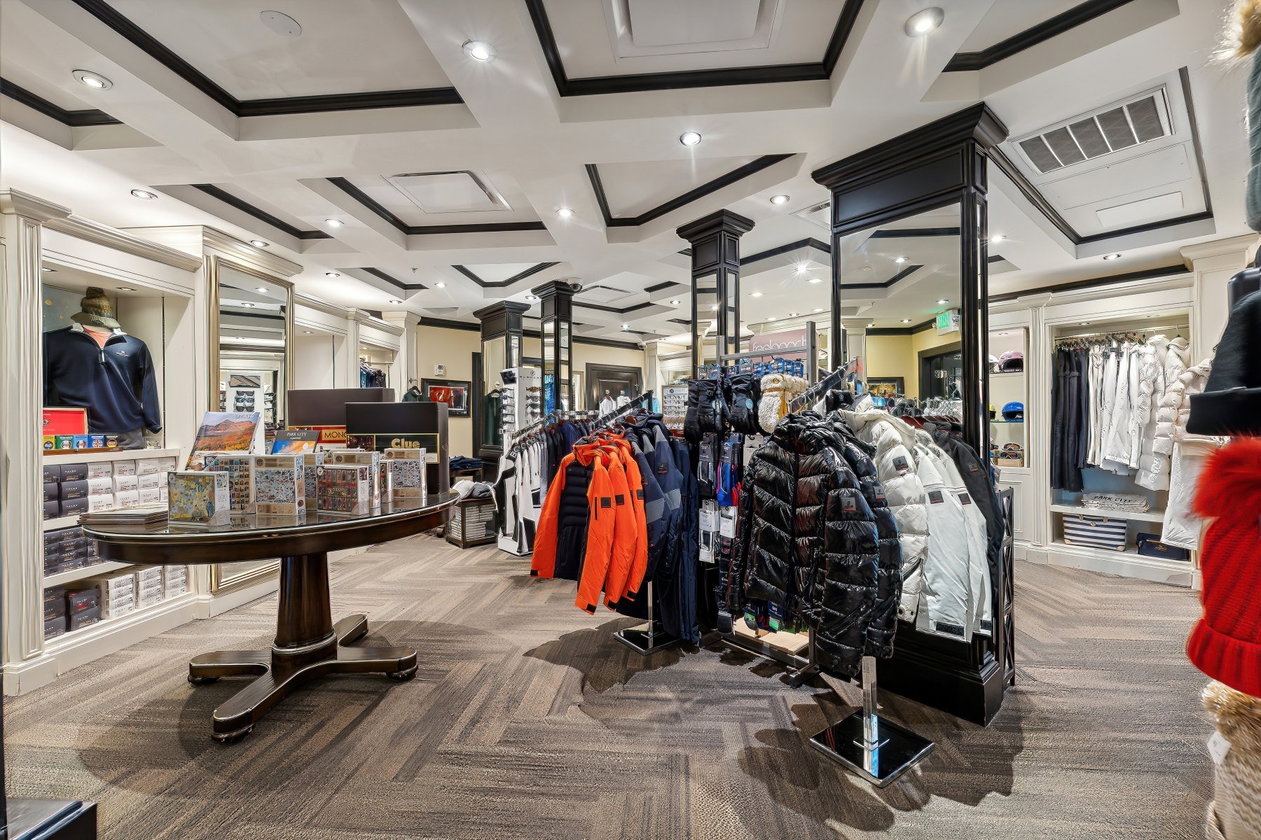 Coffered ceilings with recessed lighting, light-toned walls, and wood-finish flooring