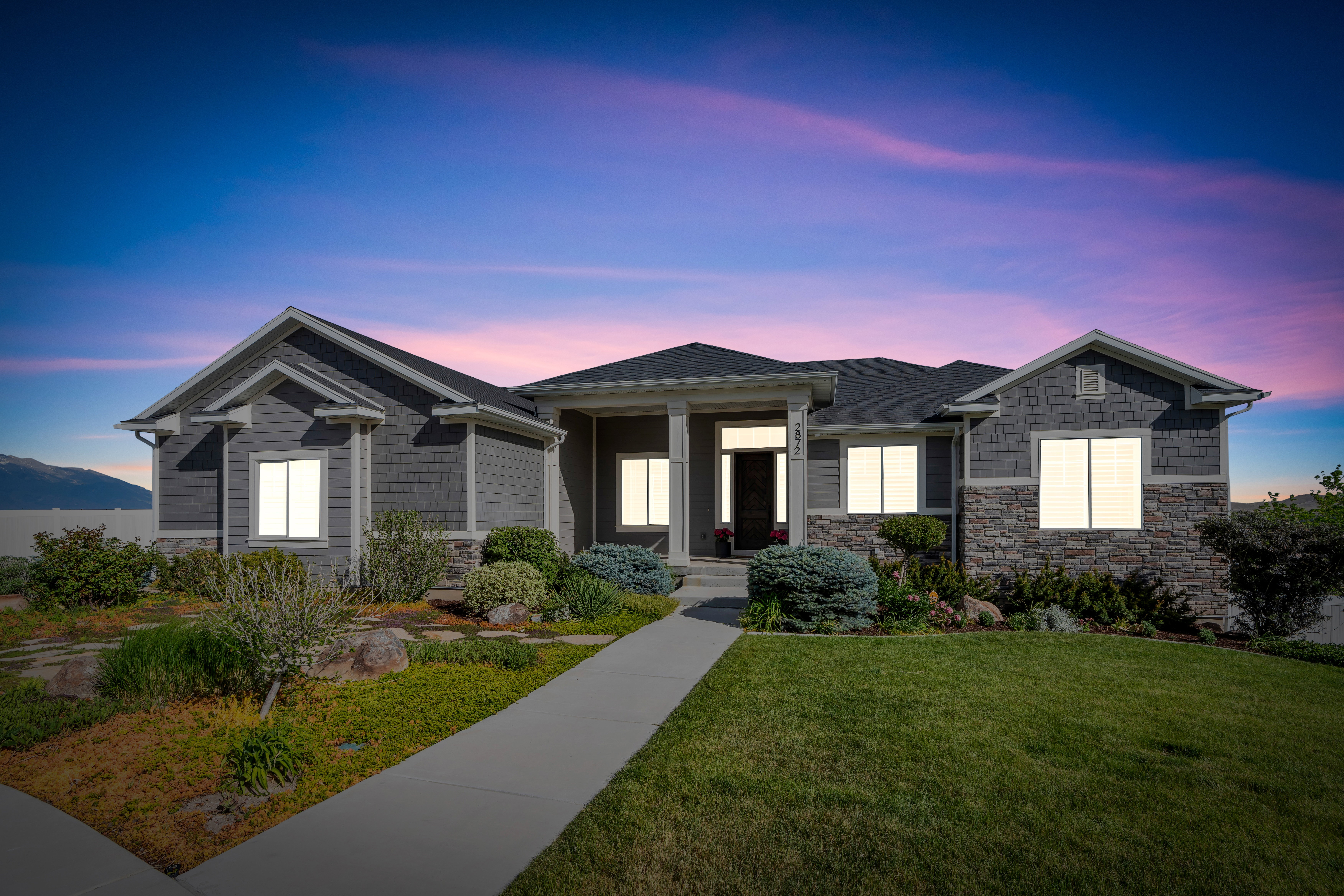 Contemporary exterior with horizontal siding and stone accents