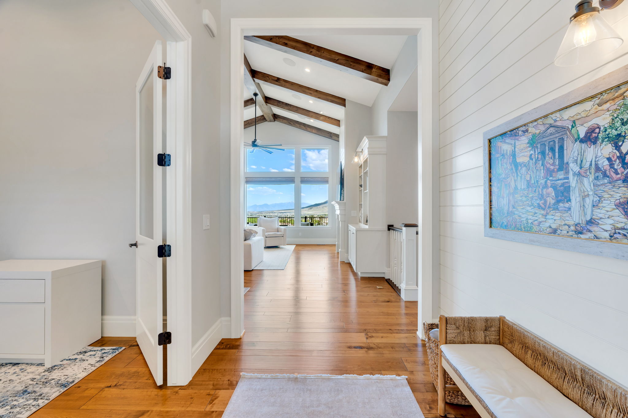 Hardwood flooring extending throughout the main living spaces