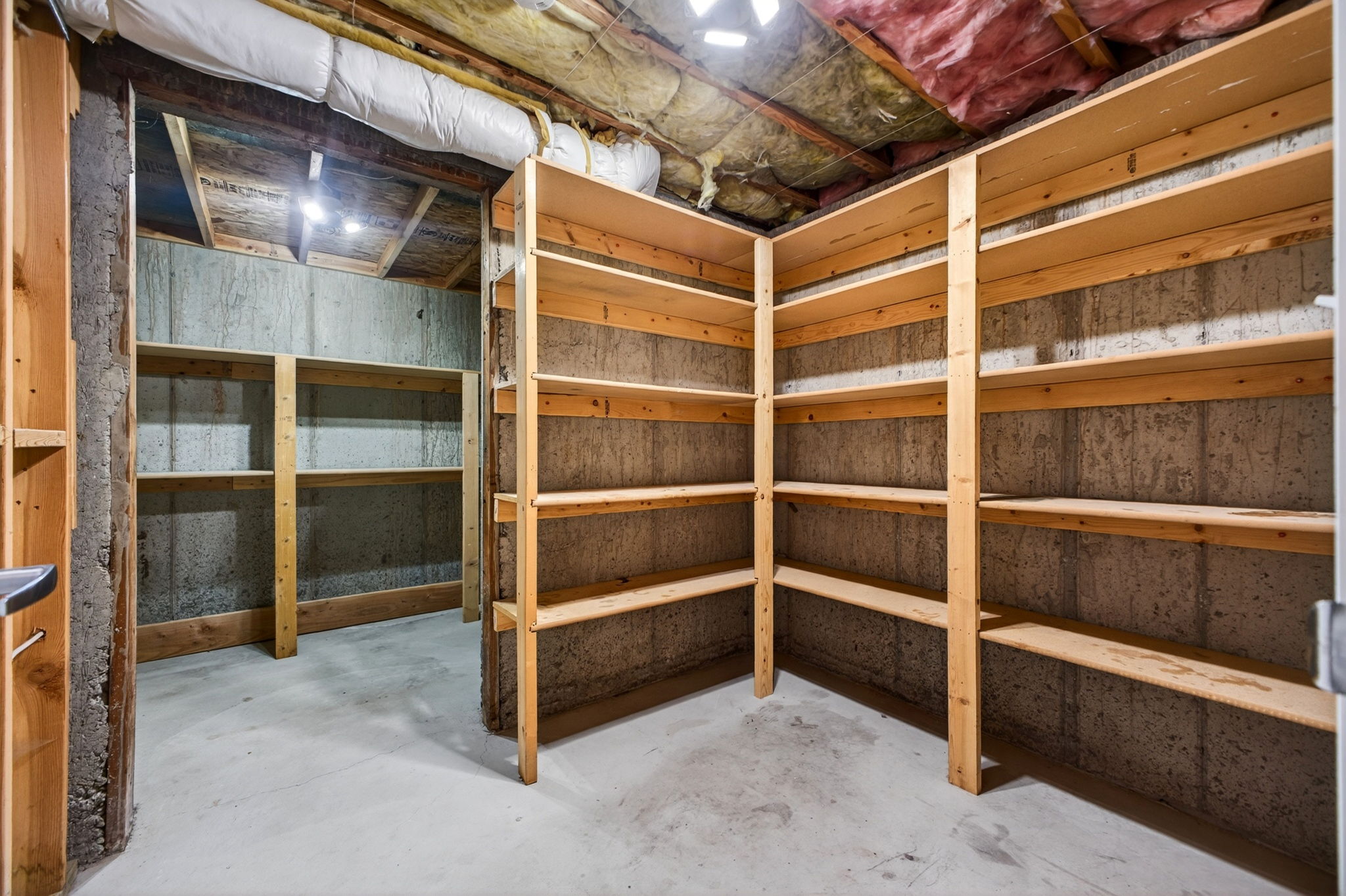 Extensive built-in wood shelving units provide ample storage capacity