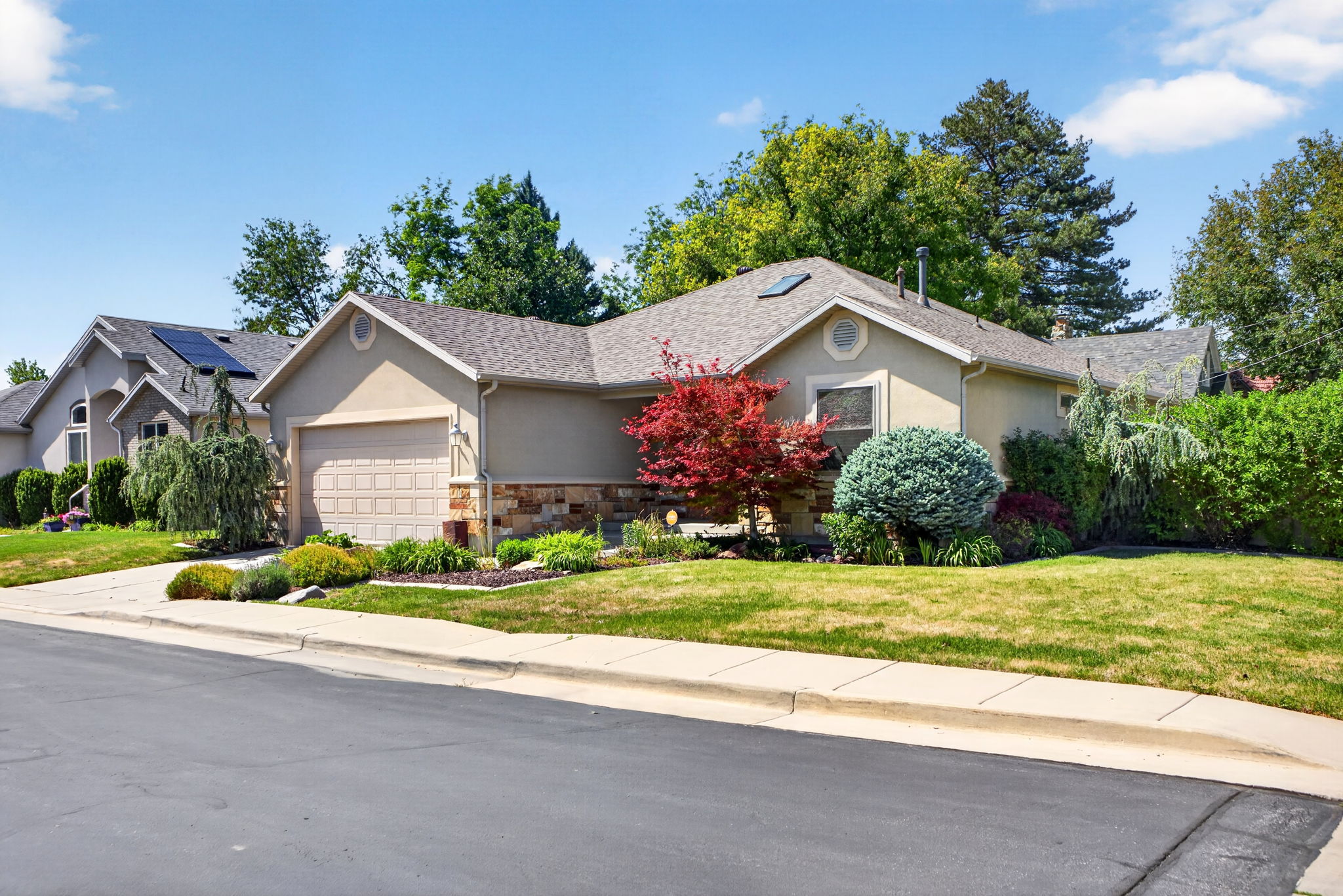 Large front lawn with mature landscaping