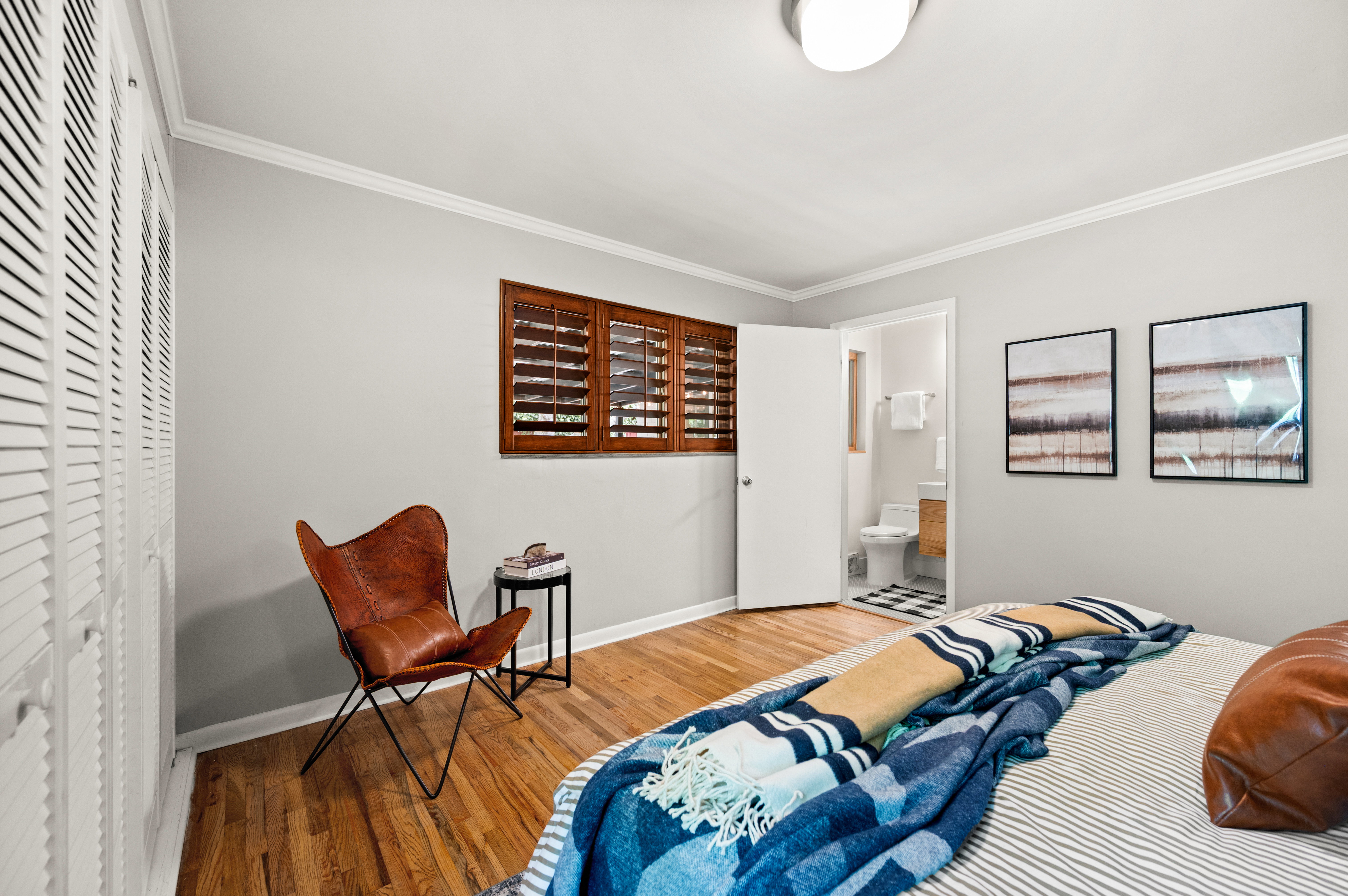 Wood-finish flooring throughout, complemented by crown molding and baseboards
