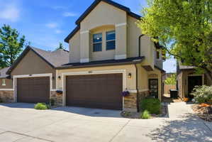 Stucco exterior with stone veneer accents