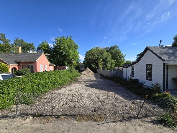 Cleared, level lot with exposed aggregate surface