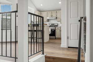 Kitchen featuring recessed lighting, light-toned cabinetry, stainless steel appliances, and a white subway tile backsplash