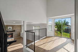 Upper-level space featuring wood-finish flooring and a sliding glass door opening to the backyard