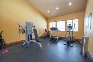 Well-equipped community fitness center with rubber flooring, cable machine, treadmill, elliptical, and stationary bike. Recessed lighting, vaulted ceilings, and natural light make this a space you'll actually want to use.