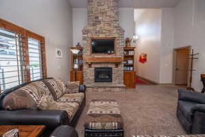 A second look at that gorgeous stacked stone fireplace and the open layout of this vaulted great room. Bright, airy, and built for real living.