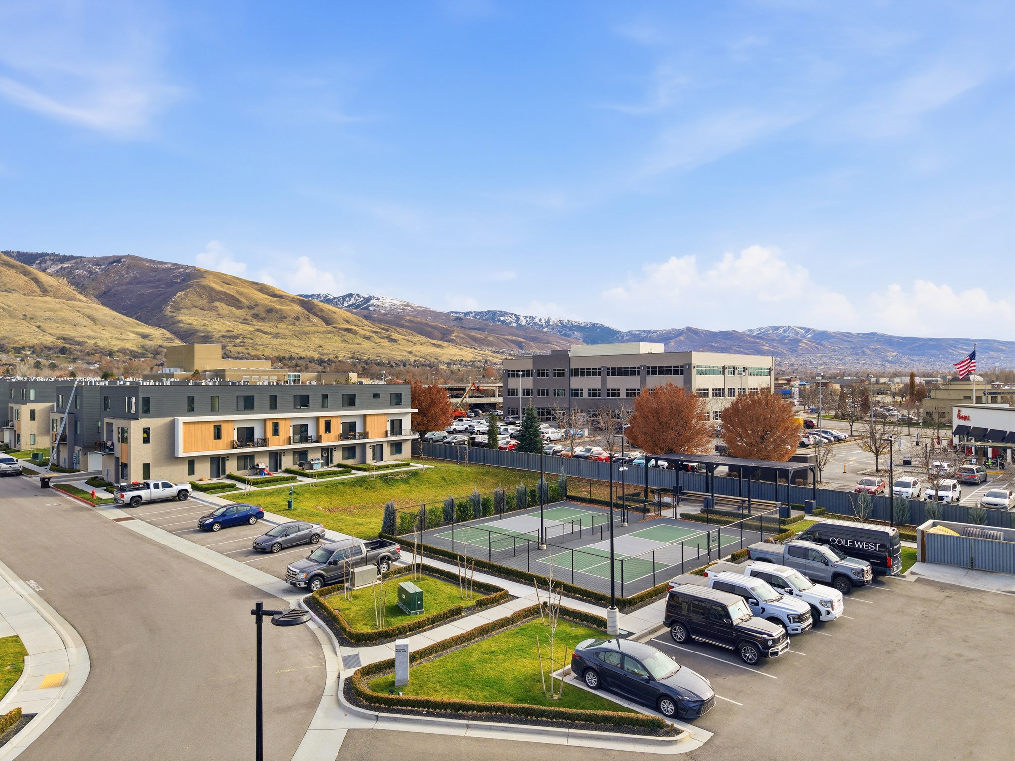 Modern townhome development featuring multi-level units with private balconies and contemporary exterior finishes