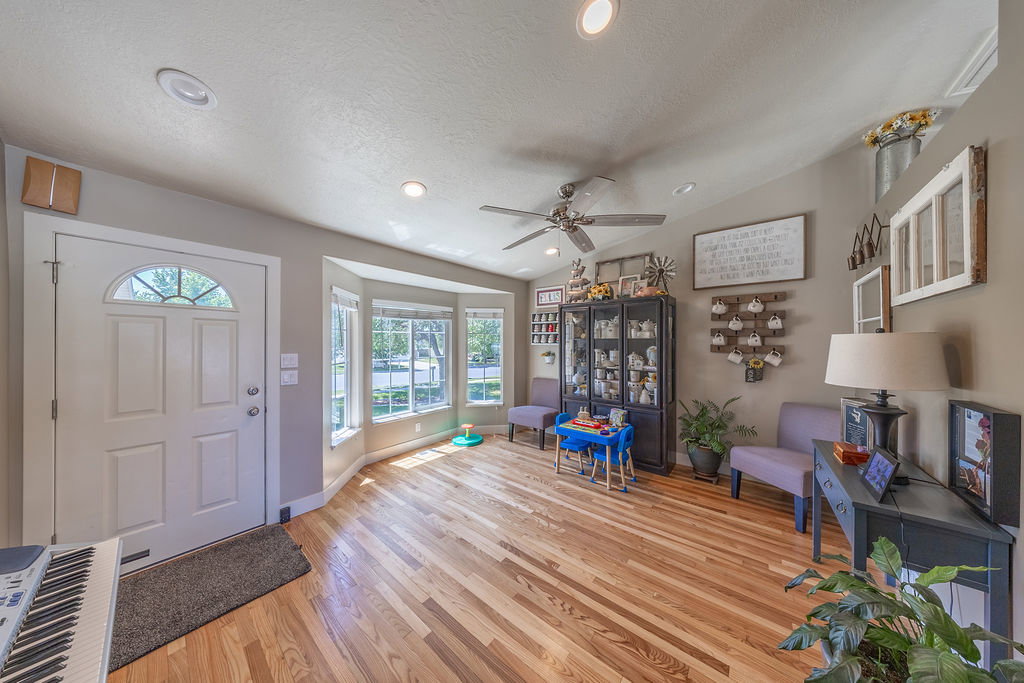 Warm wood-finish flooring throughout the room