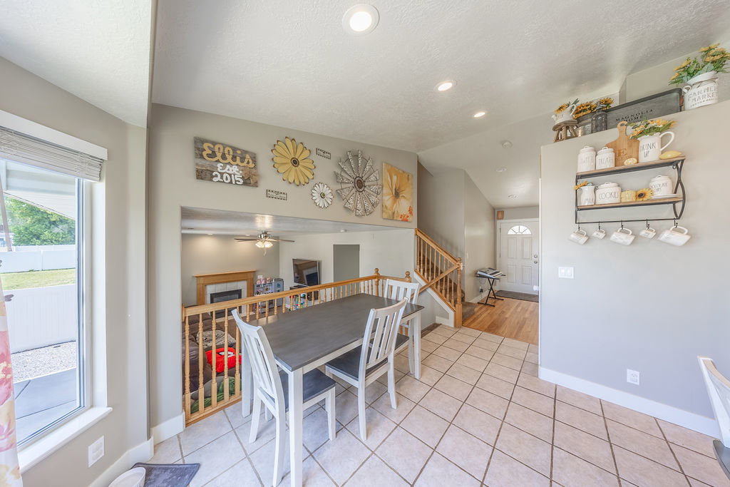 Spacious tiled dining area with recessed lighting