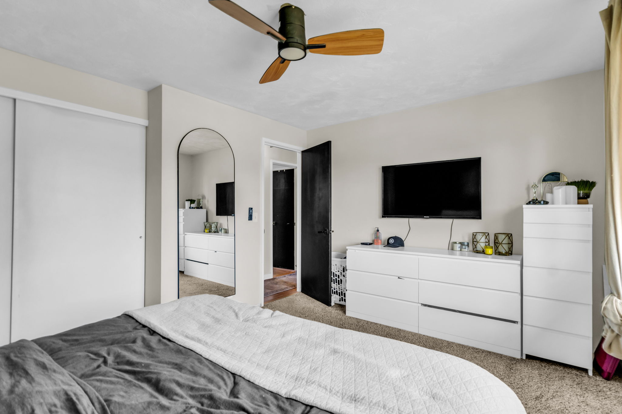 Neutral-toned interior featuring plush carpet flooring
