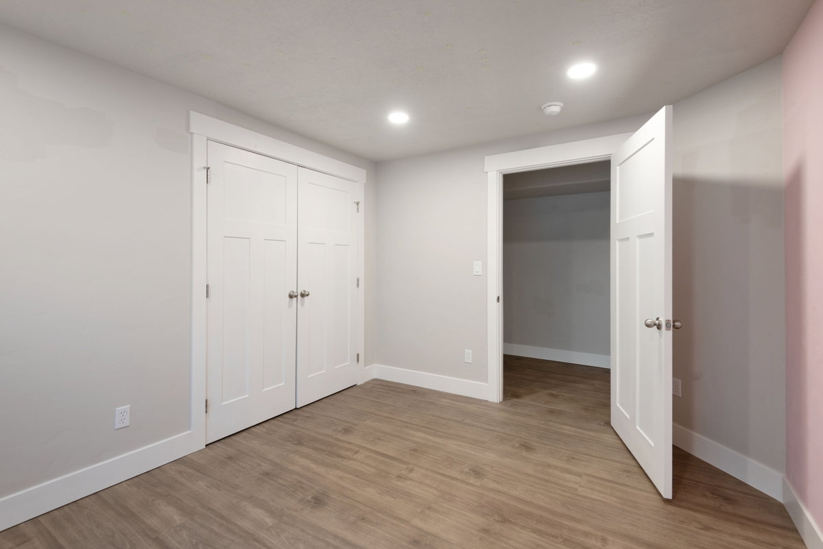 Interior room featuring wood-finish flooring and recessed lighting
